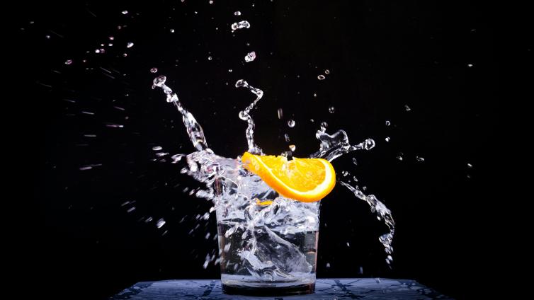 Glass of water with an orange slice